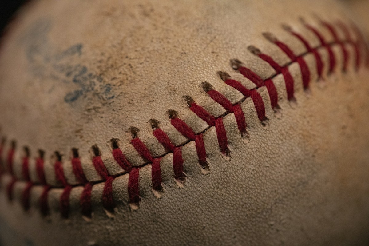 Close-up of used baseballs illustrating a sports memorabilia auction guide. Photo by Mick Haupt on Unsplash.
